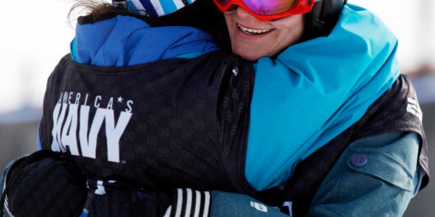 Kaya Turski, right, of Canada, is hugged after winning the skiing slopestyle women's final during the Winter X Games 14 at Buttermilk Mountain outside Aspen, Colo., on Thursday, Jan. 28, 2010. (AP Photo/David Zalubowski)