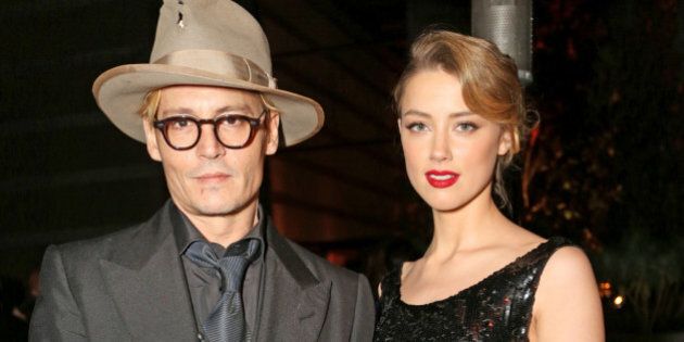 LOS ANGELES, CA - JANUARY 11: Actor Johnny Depp (L) and actress Amber Heard attend Perrier-Jouet Celebration of The Art of Elysium's 7th Annual HEAVEN Gala presented By Mercedes-Benz at Skirball Cultural Center on January 11, 2014 in Los Angeles, California. (Photo by Rachel Murray/Getty Images for Perrier-Jouet)