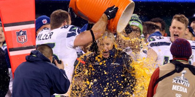 EAST RUTHERFORD, NJ - FEBRUARY 02: Tight end Zach Miller #86 of the Seattle Seahawks dumps Gatorade on head coach Pete Carroll in the fourth quarter of Super Bowl XLVIII against the Denver Broncos at MetLife Stadium on February 2, 2014 in East Rutherford, New Jersey. The Seattle Seahawks won 43-8. (Photo by Jeff Gross/Getty Images)