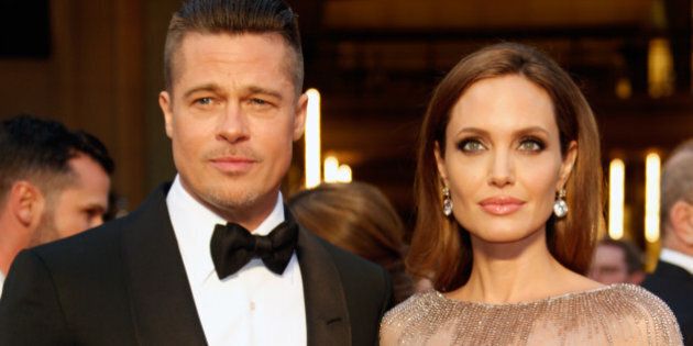 HOLLYWOOD, CA - MARCH 02: Actors Brad Pitt (L) and Angelina Jolie attend the 86th Oscars held at Hollywood & Highland Center on March 2, 2014 in Hollywood, California. (Photo by Jeff Vespa/WireImage)