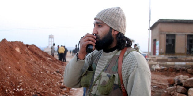 ALEPPO, SYRIA - JANUARY 4: A man is seen during clashes between the Free Syrian Army (FSA) and the Islamic State of Syria and Al-Sham (or ISIS) on January 4, 2014 in Aleppo, Syria. (Photo by Salih Mahmud Leyla/Anadolu Agency/Getty Images)