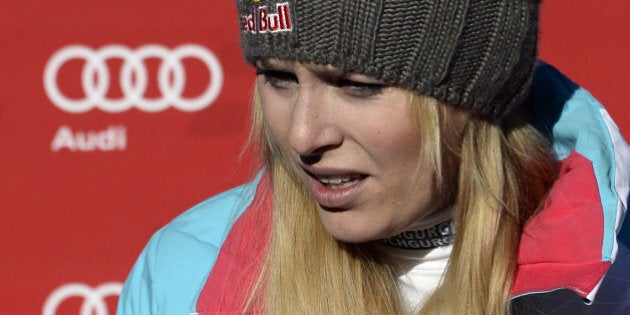 USA's Lindsey Vonn grimaces as she leaves after missing a gate while competing in the women's downhill race at the FIS Alpine Skiing World Cup in Val d'Isere in the French Alps on December 21, 2013. Vonn failed to put together a winning run for onlooking boyfriend Tiger Woods as her unstable right knee gave way halfway down the course. Vonn insisted the incident would not have major ramifications, saying she would race a maximum of two more events before heading to Sochi to defend her Olympic downhill title in February. AFP PHOTO / FRANCK FIFE (Photo credit should read FRANCK FIFE/AFP/Getty Images)