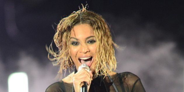 Beyonce Knowles performs on stage for the 56th Grammy Awards at the Staples Center in Los Angeles, California, January 26, 2014. AFP PHOTO FREDERIC J. BROWN (Photo credit should read FREDERIC J. BROWN/AFP/Getty Images)