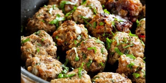 meatballs cooking in a pan ...