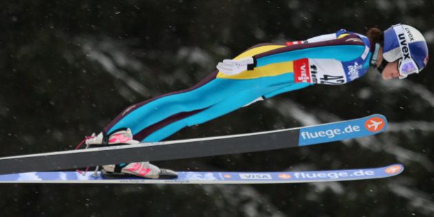 US Sarah Hendrickson soars through the air at the Women's Normal Hill event of the FIS Nordic World Ski Championships at the Ski Jumping stadium in Predazzo, north Italy on February 22, 2013. AFP PHOTO / PIERRE TEYSSOT (Photo credit should read Pierre Teyssot/AFP/Getty Images)