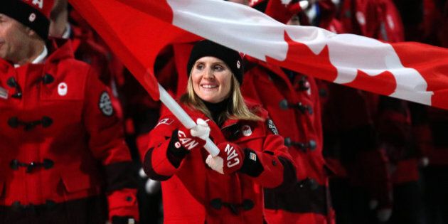 SOCHI, RUSSIA - FEBRUARY 7: Hayley Wickenheiser is the flag bearer for Canada during the Opening Ceremony of the 2014 Winter Olympic Games at the Fisht Olympic Stadium on February 7, 2014 in Sochi, Russia. (Photo by John Berry/Getty Images)