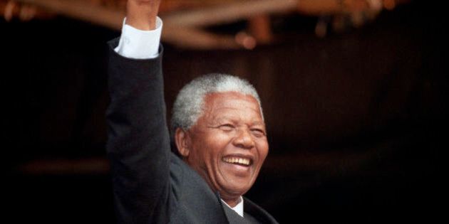 File photo dated 09/10/1993 of ANC President, Nelson Mandela, acknowledging the crowd at a rally in Glasgow after he had earlier received the Freedom of the City, the former South African president has died aged 95, the country's president Jacob Zuma said tonight.