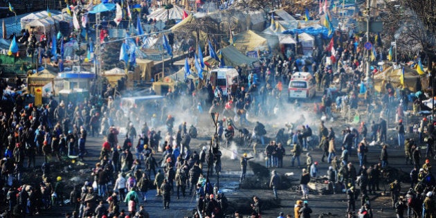 KIEV, UKRAINE - FEBRUARY 20: Anti-government protesters rebuild barricades following continued clashes with police in Independence square, despite a truce agreed between the Ukrainian president and opposition leaders on February 20, 2014 in Kiev, Ukraine. After several weeks of calm, violence has again flared between police and anti-government protesters, who are calling to oust President Viktor Yanukovych over corruption and an abandoned trade agreement with the European Union (Photo by Jeff J Mitchell/Getty Images)