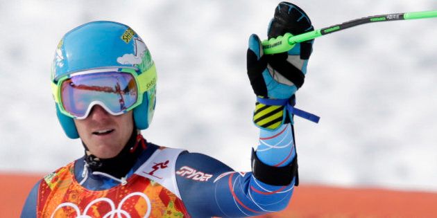 United States' Ted Ligety waves from the finish area after completing the first run of the men's giant slalom at the Sochi 2014 Winter Olympics, Wednesday, Feb. 19, 2014, in Krasnaya Polyana, Russia. (AP Photo/Gero Breloer)