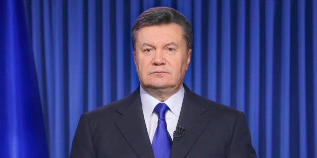 Ukrainian President Viktor Yanukovych addresses the nation on a live TV broadcast in Kiev, Ukraine, early Wednesday, Feb. 19, 2014. In a statement published online early Wednesday, Yanukovych blamed opposition leaders for the violence, saying that they had ?crossed a line when they called people to arms.? (AP Photo/Andrei Mosienko, Pool)
