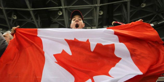 Sochi, Russia - February 12 - SSOLY- Canadian fan Edward Cowie celebrates the Canadian victory.At the Winter Olympics in Sochi, the Canadian women's hockey team beat the USA 3-2 at Shayba Arena.February 12, 2014 (Richard Lautens/Toronto Star via Getty Images)