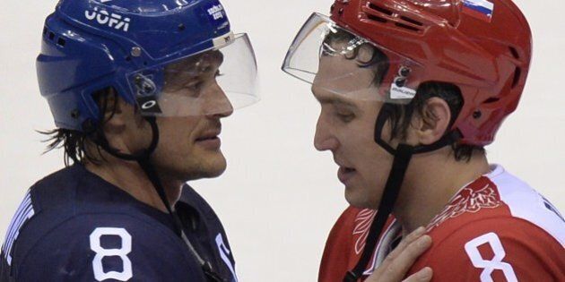 Russia's Alexander Ovechkin (R) talks to Finland's Teemu Selanne at the end of the Men's Ice Hockey Play-offs Quarterfinals match between Finland and Russia at the Bolshoy Ice Dome during the Sochi Winter Olympics on February 19, 2014. Finland won 3-1. AFP PHOTO / ALEXANDER NEMENOV (Photo credit should read ALEXANDER NEMENOV/AFP/Getty Images)