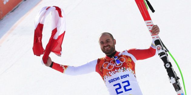 Canada's Jan Hudec poses on the podium for the Men's Alpine Skiing Super-G Flower Ceremony at the Rosa Khutor Alpine Center during the Sochi Winter Olympics on February 16, 2014. AFP PHOTO / ALEXANDER KLEIN (Photo credit should read ALEXANDER KLEIN/AFP/Getty Images)