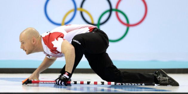 Canada's Ryan Fry watches the rock during the men's curling competition at the 2014 Winter Olympics, Monday, Feb. 10, 2014, in Sochi, Russia. (AP Photo/Wong Maye-E)