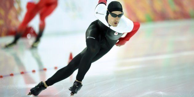 Canada's Denny Morrison competes in the Men's Speed Skating 1500 m at the Adler Arena during the Sochi Winter Olympics on February 15, 2014. AFP PHOTO / JUNG YEON-JE (Photo credit should read JUNG YEON-JE/AFP/Getty Images)