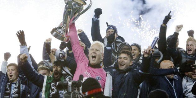 Sporting KC celebrates with the MLS Cup after defeating Real Salt Lake in the MLS Cup Final at Sporting Park in Kansas City, Kan., Saturday, Dec. 7, 2013. Sporting won on penalty kicks. (Allison Long/Kansas City Star/MCT via Getty Images)