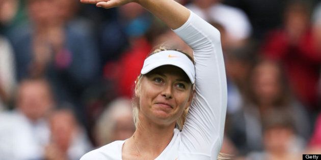 LONDON, ENGLAND - JUNE 24: Maria Sharapova of Russia waves to the crowd as she celebrates match point during her Ladies' Singles first round match against Kristina Mladenovic of France on day one of the Wimbledon Lawn Tennis Championships at the All England Lawn Tennis and Croquet Club on June 24, 2013 in London, England. (Photo by Clive Brunskill/Getty Images)