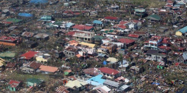 IN AIR, PHILIPPINES - NOVEMBER 10: In this handout from the Malacanang Photo Bureau, an aerial view of buildings destroyed in the aftermath of Typhoon Haiyan on November 10, 2013 over the Leyte province, Philippines. Typhoon Haiyan, packing maximum sustained winds of 195 mph (315 kph), slammed into the southern Philippines and left a trail of destruction in multiple provinces, forcing hundreds of thousands to evacuate and making travel by air and land to hard-hit provinces difficult. Around 10,000 people are feared dead in the strongest typhoon to hit the Philippines this year. (Photo by Ryan Lim/Malacanang Photo Bureau via Getty Images)