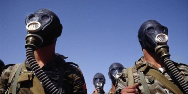 SAUDI ARABIA - MARCH 1990: Syrian troops photographed during a gas mask training exercise during the run up to the first Gulf War. (Photo by Tom Stoddart/Getty Images)