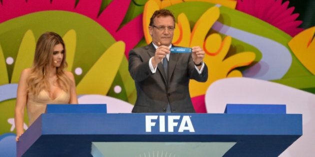 COSTA DO SAUIPE, BRAZIL - DECEMBER 06: FIFA Secretary General Jerome Valcke holds up the name of Australia during the Final Draw for the 2014 FIFA World Cup Brazil at Costa do Sauipe Resort on December 6, 2013 in Costa do Sauipe, Bahia, Brazil. (Photo by Buda Mendes/Getty Images)