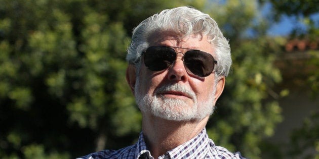 SAN ANSELMO, CA - JUNE 20: Film director George Lucas looks on during the unveiling of bronze statues of 'Star Wars' character Yoda and Indiana Jones that are displayed at the new Imagination Park on June 20, 2013 in San Anselmo, California. Bronze statues of the 'Star Wars' character Yoda and Indiana Jones were unveiled at the new 8,700 square foot Imagination Park in downtown San Anselmo that was donated by 'Star Wars' creator and San Anselmo resident George Lucas. Lucas donated the property, paid for park plans and demolition of the existing structures. (Photo by Justin Sullivan/Getty Images)