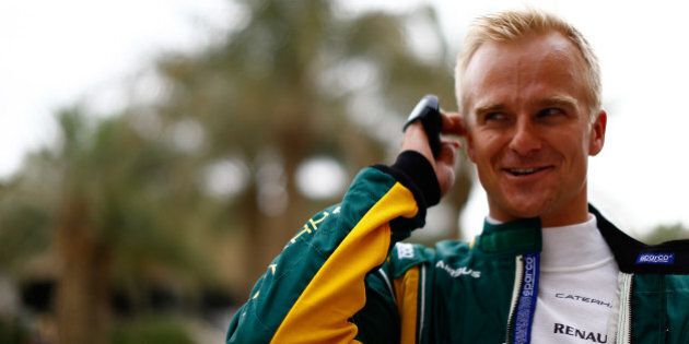 SAKHIR, BAHRAIN - APRIL 18: Heikki Kovalainen of Finland and Caterham is seen in the paddock during previews for the Bahrain Formula One Grand Prix at the Bahrain International Circuit on April 18, 2013 in Sakhir, Bahrain. (Photo by Vladimir Rys/Getty Images)