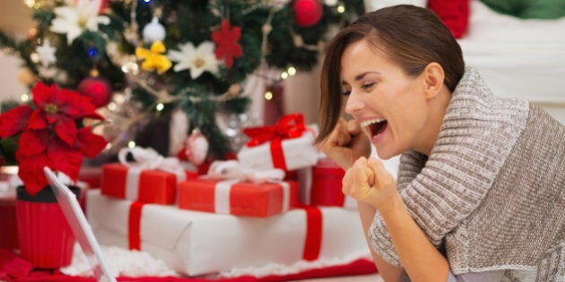 happy woman with laptop near...