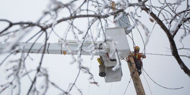 SCARBOROUGH, ON - DECEMBER 25 - Ben Brown from Sault Ste. Marie flew to Toronto to help restore power on Christmas Day to households in Scarborough that have been without electricity since a major ice storm struck Toronto. December 25, 2013. (Randy Risling/Toronto Star via Getty Images)