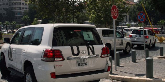 A convoy of United Nations (UN) vehicles leave a hotel in Damascus on August 26, 2013 carrying UN inspectors travelling to the site of a suspected deadly chemical weapon attack the previous week in Ghouta, east of the capital. The Syrian authorities approved the UN inspection of the site, but US officials said it was too little, too late, arguing that persistent shelling there in recent days had 'corrupted' the site. AFP PHOTO / STR (Photo credit should read STR/AFP/Getty Images)