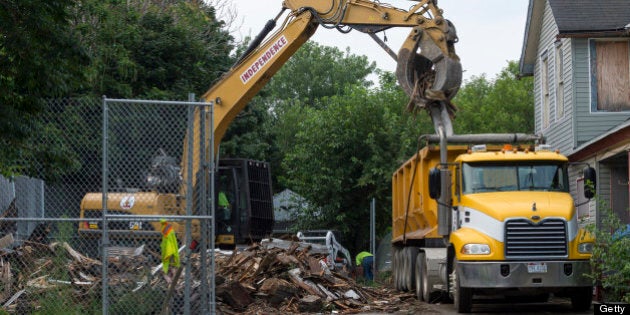 CLEVELAND, OH - AUGUST 7: Demoliton crews clean up the remains of Ariel Castro's home after it was torn down on August 7, 2013 in Cleveland, Ohio. The State of Ohio leveled Castro's home less than one week after Castro was sentenced to life in prison with no parole plus one thousand years for abducting three young women between 2002 and 2004. The women escaped this past May. (Photo by Angelo Merendino/Getty Images)