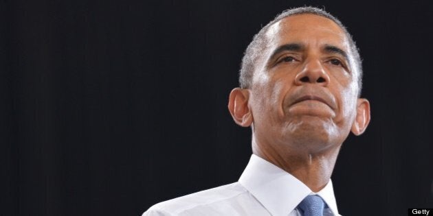 US President Barack Obama pauses as he speaks on home ownership for the middle class at Desert Vista High School on August 6, 2013 in Phoenix, Arizona. AFP PHOTO/Mandel NGAN (Photo credit should read MANDEL NGAN/AFP/Getty Images)