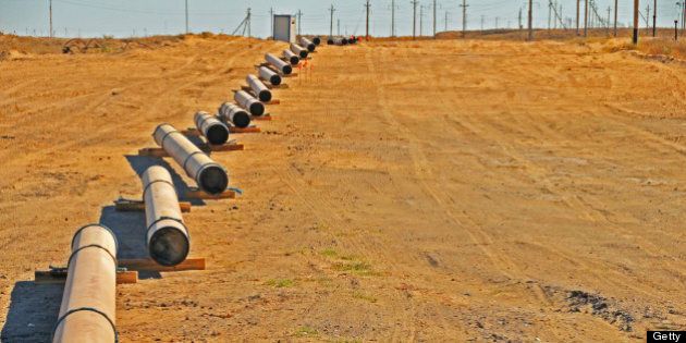 Pipes are arranged in preparation to lay down a new pipeline in the oil and gas industry. Shallow Depth of Field.