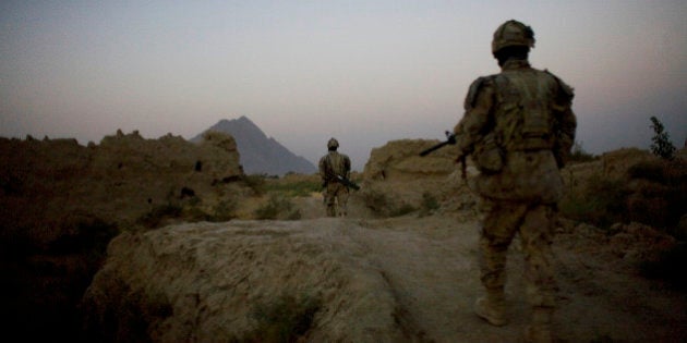 Canadian soldiers with the 1st RCR Battle Group, the Royal Canadian Regiment, patrol before sunrise in the Panjwaii district, near Salavat, southwest of Kandahar, Afghanistan, Thursday, Sept. 9, 2010. (AP Photo/Anja Niedringhaus)