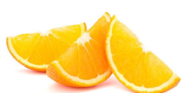 three orange fruit segments or...