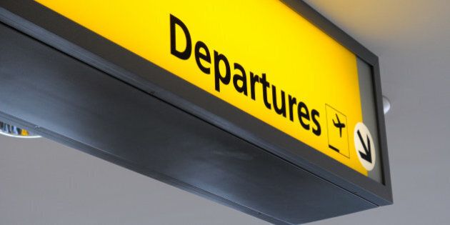 departure sign at an airport.