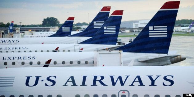 CHARLOTTE, NC - SEPTEMBER 01: U.S. Airways planes sit on the tarmac at Charlotte/Douglas International Airport on September 1, 2012 in Charlotte, North Carolina. American Airlines and U.S. Airways have announced that they have begun merger talks. (Photo by Kevork Djansezian/Getty Images)