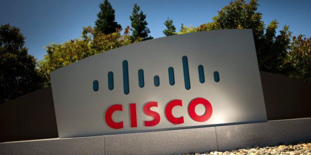 Cisco Systems Inc. signage is displayed outside of the company's headquarters in San Jose, California, U.S., on Tuesday, July 12, 2011. Cisco Systems Inc., the largest networking-equipment company, may cut as many as 10,000 jobs, or about 14 percent of its workforce, to revive profit growth, according to two people familiar with plans. Photographer: David Paul Morris/Bloomberg via Getty Images
