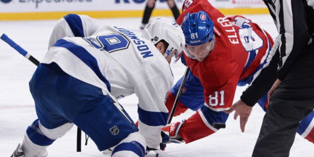 MONTREAL, QC - NOVEMBER 12: Lars Eller #81 of the Montreal Canadiens and Tyler Johnson #9 of the Tampa Bay Lightning face-off during the NHL game on November 12, 2013 at the Bell Centre in Montreal, Quebec, Canada. (Photo by Francois Lacasse/NHLI via Getty Images)