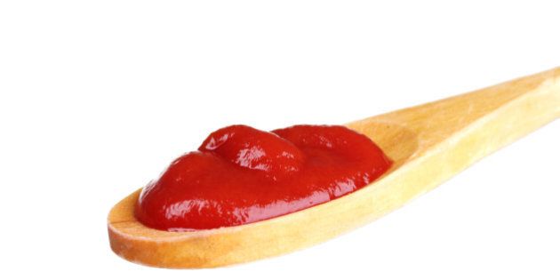 tasty ketchup in wooden spoon...