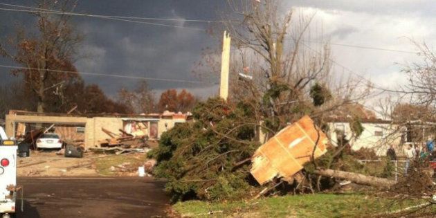 PEORIA, ILLINOIS - NOVEMBER 17: A heavily damaged home and a uprooted tree are seen after a tornado on November 17, 2013 in Peoria, Illinois. Powerful tornadoes have swept through the US Midwest, destroying buildings and killing three people in the states of Illinois. (Photo by Jack Lance/Anadolu Agency/Getty Images)