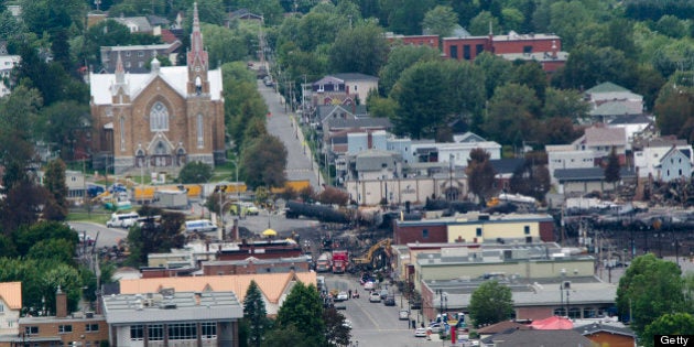 Scorched oil tankers remain on July 10, 2013 at the train derailment site in Lac-Megantic, Quebec. Edward Bukhardt, CEO of Montreal, Maine and Atlantic Railways Inc.,(MMA) told reporters Wednesday that the train was left running while the engineer spent the night sleeping in a hotel in Nantes, adding that the engineer was following standard 'industry practice.' The train carrying crude oil from North Dakota derailed in the town of Lac-Megantic overnight Friday, causing a massive fire and explosions that killedat least 15 people, with another 45 still missing. AFP PHOTO/STEEVE DUGUAY (Photo credit should read STEEVE DUGUAY/AFP/Getty Images)