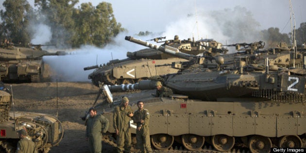 Israeli soldiers are seen with their Merkava tank unit deployed in the Israeli annexed Golan Heights near the border with Syria, on May 6, 2013. UN chief Ban Ki-moon has appealed for restraint after Israeli air strikes on targets near Damascus which prompted Syrian officials to warn 'missiles are ready' to retaliate. AFP PHOTO/MENAHEM KAHANA (Photo credit should read MENAHEM KAHANA/AFP/Getty Images)