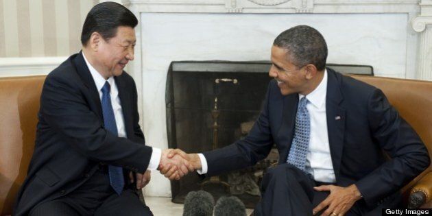 US President Barack Obama shakes hands with Chinese Vice President Xi Jinping during meetings in the Oval Office of the White House in Washington, DC, February 14, 2012. AFP PHOTO / Saul LOEB (Photo credit should read SAUL LOEB/AFP/Getty Images)