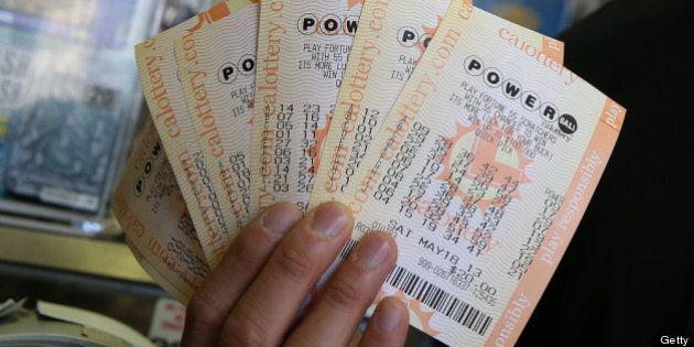SAN FRANCISCO, CA - MAY 17: A customer holds $140 worth of Powerball tickets that he just purchased on May 17, 2013 in San Francisco, California. People are lining up to purchase $2 Powerball tickets as the multi-state jackpot hits $600 million. (Photo by Justin Sullivan/Getty Images)