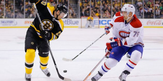 BOSTON, MA - MARCH 27: Daniel Paille #20 of the Boston Bruins and Andrei Markov #79 of the Montreal Canadiens battle for the puck during the game on March 27, 2013 at TD Garden in Boston, Massachusetts. (Photo by Jared Wickerham/Getty Images)
