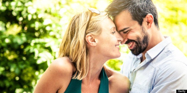 Couple embracing in the city park.