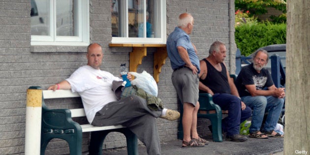 Residents return home in the Fatima district July 9, 2013 near Lac -Megantic, Quebec. According to the owners of the train that leveled Lac-Mégantic, the simple rupture of a fuel or oil line, the fourth such rupture on a Montreal, Maine & Atlantic locomotive in the last eight years, may have been all that was needed to set in motion one of the most devastating rail disasters in Canadian history. Either way, both veteran railroaders and locals are disputing company assertions that local firefighters powering down a locomotive in order to put out a small fire was all it took to send 73 oil cars hurtling towards Lac-Mégantic. AFP PHOTO/STEEVE DUGUAY (Photo credit should read STEEVE DUGUAY/AFP/Getty Images)