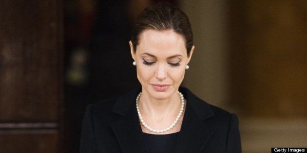 US actress and humanitarian campaigner Angelina Jolie leaves Lancaster House in central London on April 11, 2013 after speaking during an announcement of funding to address conflict sexual violence on the sidelines of the G8 Foreign Ministers meeting. British Foreign Secretary William Hague and Angelina Jolie spoke at the G8 Foreign Minister?s meeting to announce 10 million GBP (15,340,000 USD) funding to support efforts to tackle sexual violence in conflict and violence against women and girls (VAWG). AFP PHOTO / LEON NEAL (Photo credit should read LEON NEAL/AFP/Getty Images)