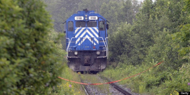 A train from the MMA (Montreal, Maine & Atlantic) railway is viewed as it was stopped by the RCMP and considered as a piece of evidence on July 9, 2013 near Lac -Megantic, Quebec. According to the owners of the train that leveled Lac-Mégantic, the simple rupture of a fuel or oil line, the fourth such rupture on a Montreal, Maine & Atlantic locomotive in the last eight years, may have been all that was needed to set in motion one of the most devastating rail disasters in Canadian history. Either way, both veteran railroaders and locals are disputing company assertions that local firefighters powering down a locomotive in order to put out a small fire was all it took to send 73 oil cars hurtling towards Lac-Mégantic. AFP PHOTO/STEEVE DUGUAY (Photo credit should read STEEVE DUGUAY/AFP/Getty Images)