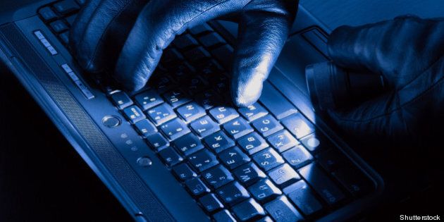 hands of hacker on a laptop